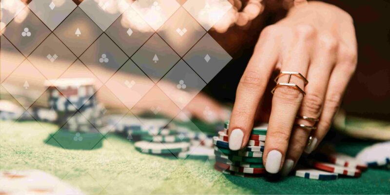 woman's hand holds poker chips on table with Poker Power grid